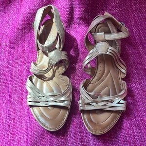 Born Crown gold sandals with a low stacked heel. Size 9.